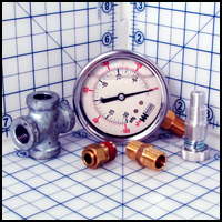 Regulator Assembly for vacuum pumps includes vacuum gauge, push-in fitting, relief valve, hex nipple and cross fitting