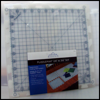 Puzzlemat 24 in. x 36 in. set with case. Edges not included.